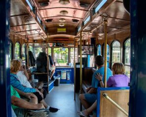 Old fashioned style trolley offering free rides near Yorktown Beach Hotel.