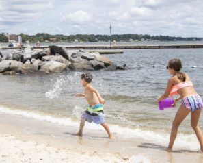 Kids playing along the beach