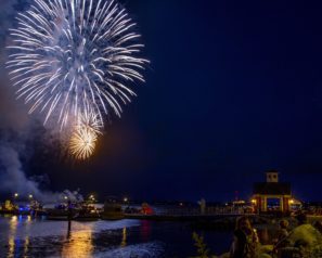 Fireworks in the night sky over the ocean