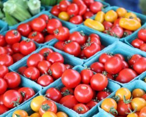 Closeup of red and yellow cherry tomatoes and okra