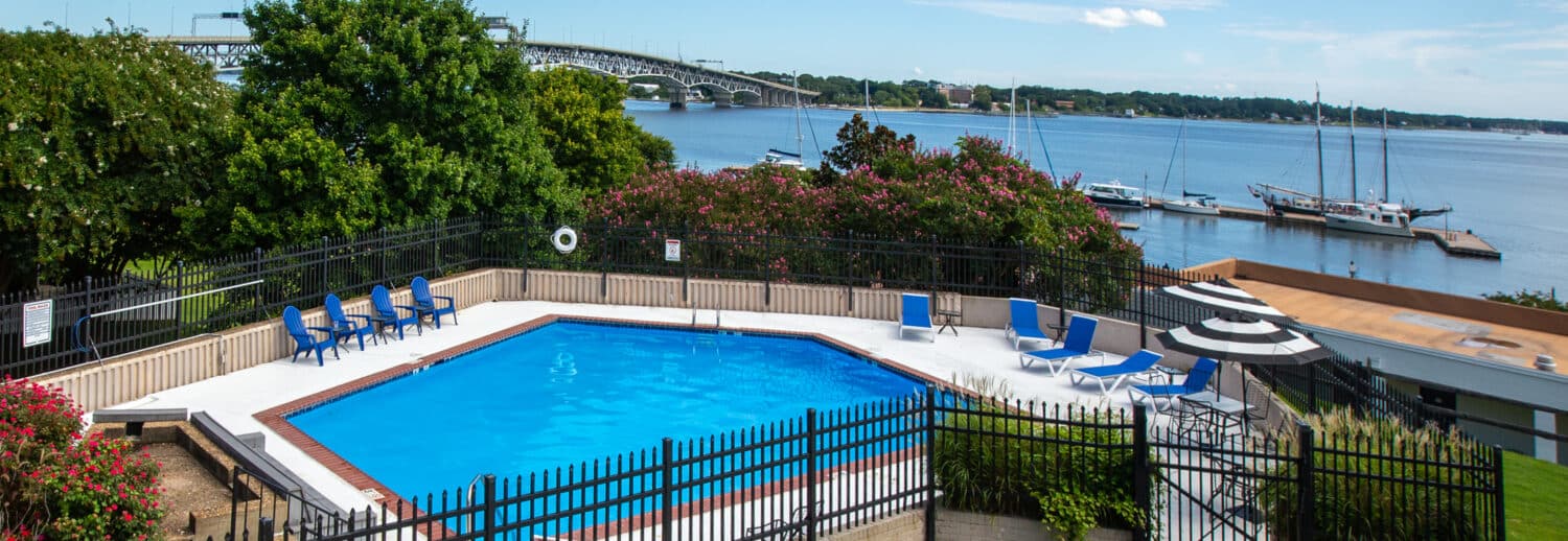 Yorktown Beach Hotel pool with crystal clear waters overlooking the Yorktown Riverwalk.