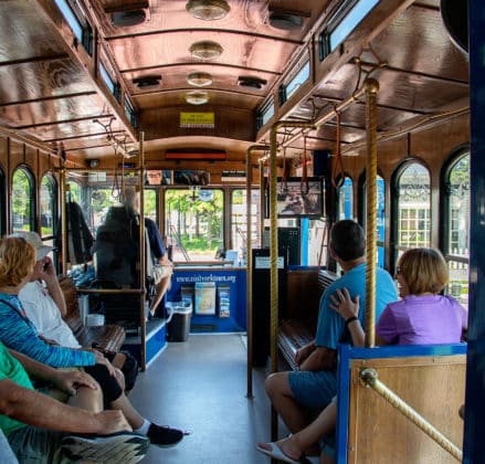 Old fashioned style trolley offering free rides near Yorktown Beach Hotel.