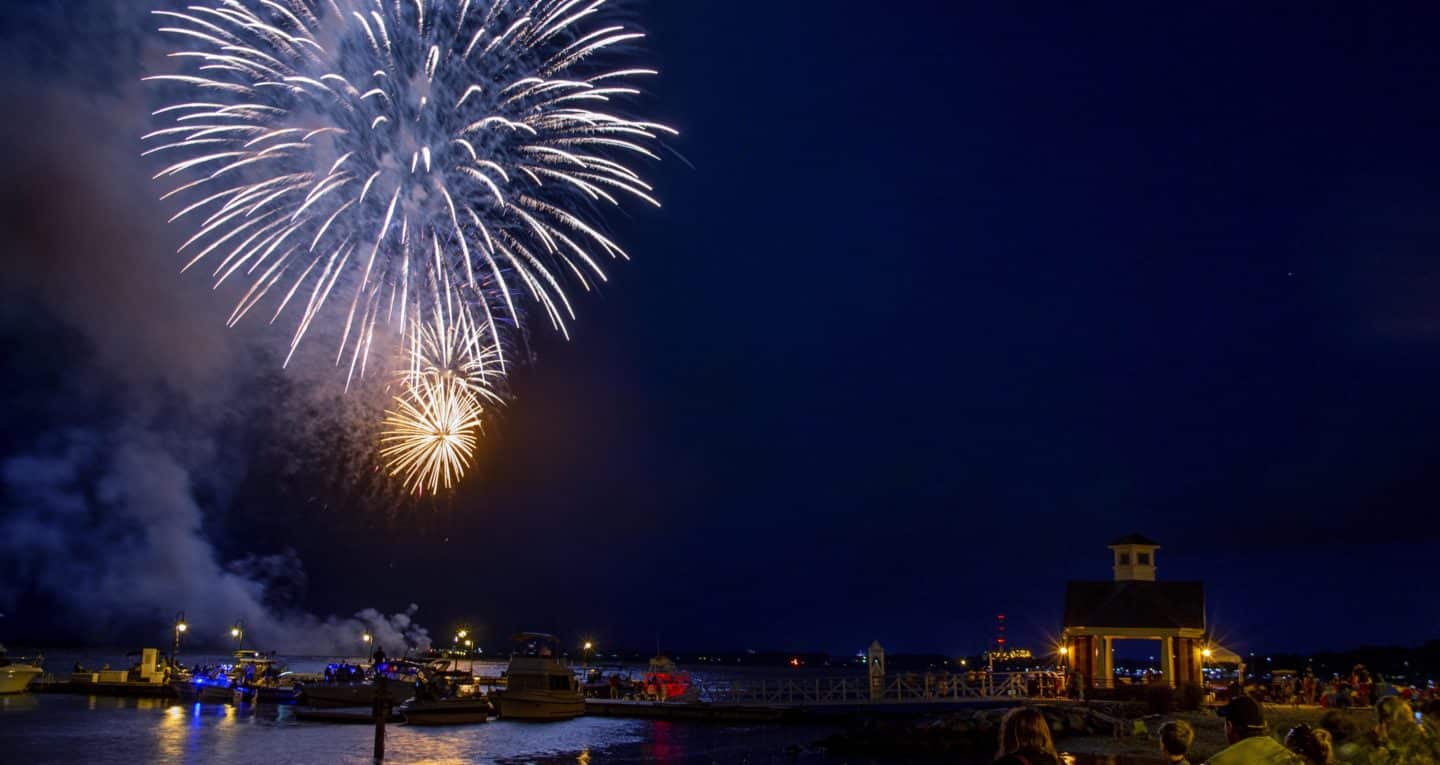 Fireworks in the night sky over the ocean